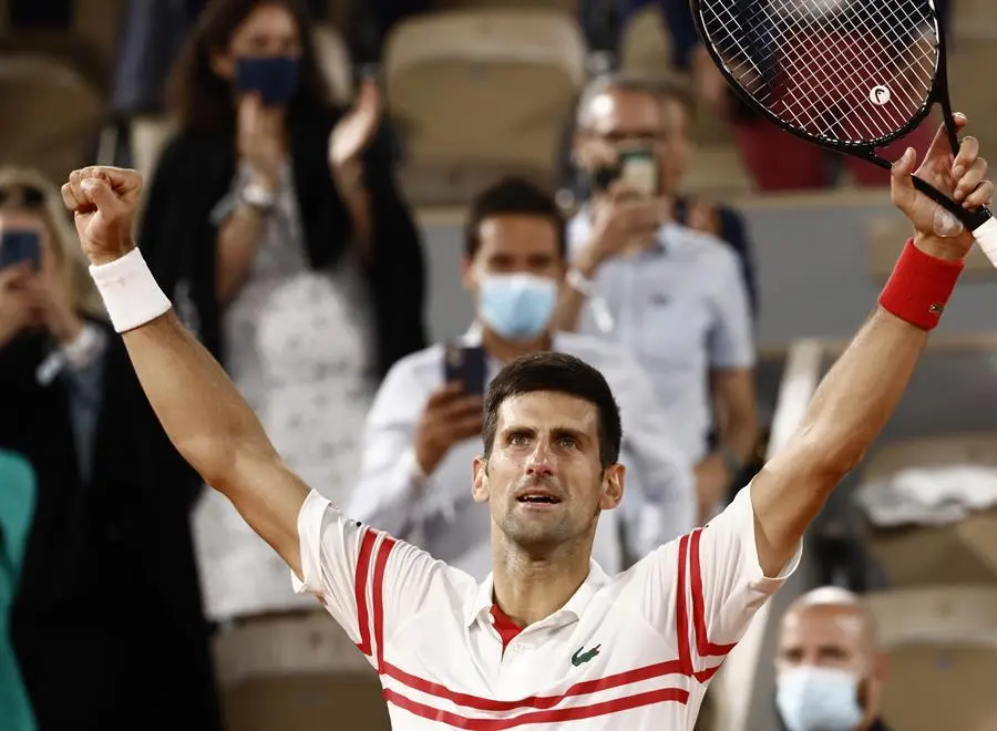 Novak Djokovic of Serbia celebrates winning against Rafael Nadal of Spain during their semi final match at the French Open tennis tournament at Roland Garros in Paris, France, 11 June 2021. (Tenis, Abierto, Francia, Espa&ntilde;a) EFE/EPA/YOAN VALAT