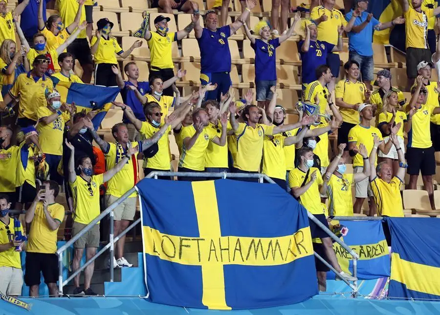 Supporters of Sweden cheer after the UEFA EURO 2020 group E preliminary round soccer match between Spain and Sweden in Seville, Spain, 14 June 2021. (Espa&ntilde;a, Suecia, Sevilla) EFE/EPA/Jose Manuel Vidal / POOL (RESTRICTIONS: For editorial news reporting purposes only. Images must appear as still images and must not emulate match action video footage. Photographs published in online publications shall have an interval of at least 20 seconds between the posting.)