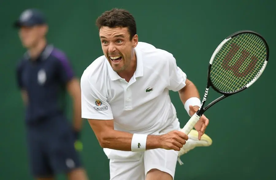 Roberto Bautista Agut of Spain in action against Miomir Kecmanovic of Serbia during their second round match at the Wimbledon Championships, Wimbledon, Britain, 30 June 2021. (Tenis, Espa&ntilde;a, Reino Unido) EFE