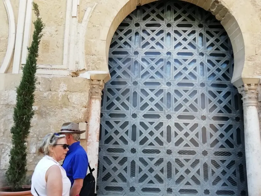 Archivo - Exterior de la denominada segunda puerta de la Mezquita de C&oacute;rdoba, cubierta por una lona con la imagen de la celosia retirada
