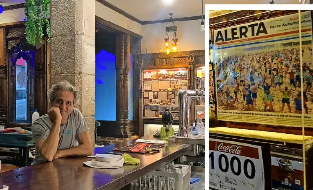 A la izquierda interior del nuevo local, junto a su due&ntilde;o, con la exposici&oacute;n de las palas, los dibujos de Mariano P&eacute;rez con motivos deportivos y algunas mesas con piezas &uacute;nicas entorno a este juego. Arriba, en una de las vitrinas se muestran recortes del diario ALERTA, donde se ve en una de sus portadas, cuando Santander bati&oacute; el r&eacute;cord del mundo de palistas jugando a la vez en la misma playa. / Hardy