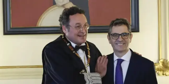 El fiscal general del Estado, &Aacute;lvaro Ortiz, junto al ministro Bola&ntilde;os. / EFE
