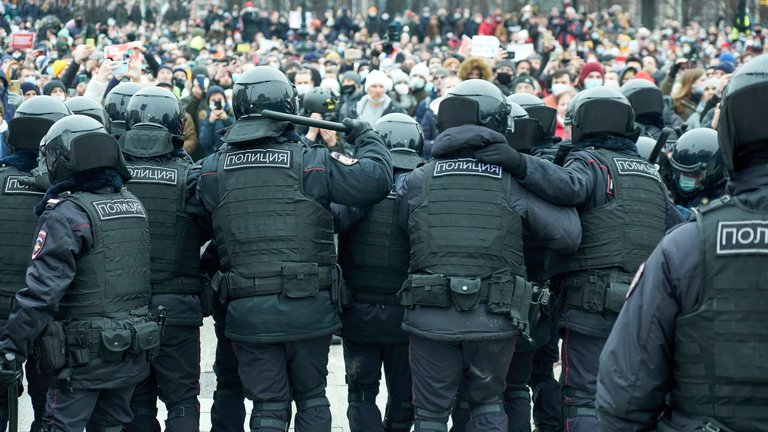 Police officers confront crowds of protesters during the demonstration..Rallies were held in the largest cities of Russia in support of the opposition leader Alexei Navalny, who was sent into custody after returning to Russia from Germany on suspicion of evading the control of the FSIN (Federal Penitentiary Service). The actions were accompanied by arrests on an unprecedented scale.