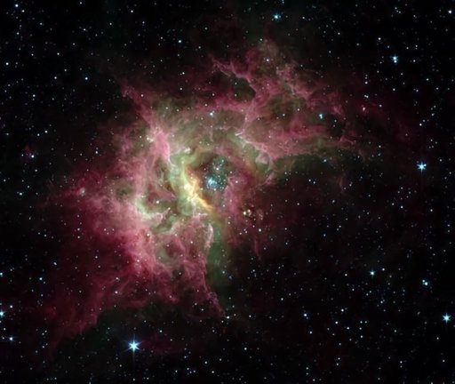 En el centro de la nebulosa de gas RCW 49 que se muestra aquí hay un cúmulo de estrellas (Westerlund 2) rodeado por una burbuja en expansión de gas caliente.
