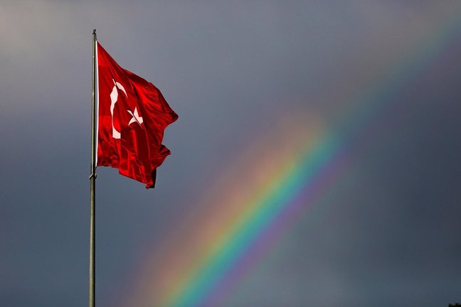 A view of a Turkish flag with a rainbow in the background after a rainfall.  Rainbow is also known as the symbol of LGBTI+ people..The picnic that the Turkey Pride Week Committee wanted to hold in Heybeliada, Istanbul as part of the pride week was banned by the Istanbul Governor's Office.  The police intervened harshly in the picnic that was planned to be held in Maçka Park by the decision of the committee.  Council of Europe Commissioner for Human Rights Dunja Mijatovic wrote a letter to the Republic of Turkey Minister of Interior Süleyman Soylu and Minister of Justice Abdülhamit Gül on June 17.  ''Stop stigmatizing homosexuals,'' Mijatovic said in the letter, the content of which was revealed on June 25.  In addition, it was stated in the letter that Turkey is obliged to protect the right to assembly and demonstration of LGBTI+ as written in the European Convention on Human Rights.