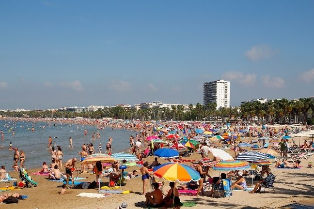 SALOU, SPAIN - JUNE 21, 2015: People relaxing and having fun on the beach to have their holidays on June 21, 2015 at the coast of Salou, Spain, a famous tourist destination