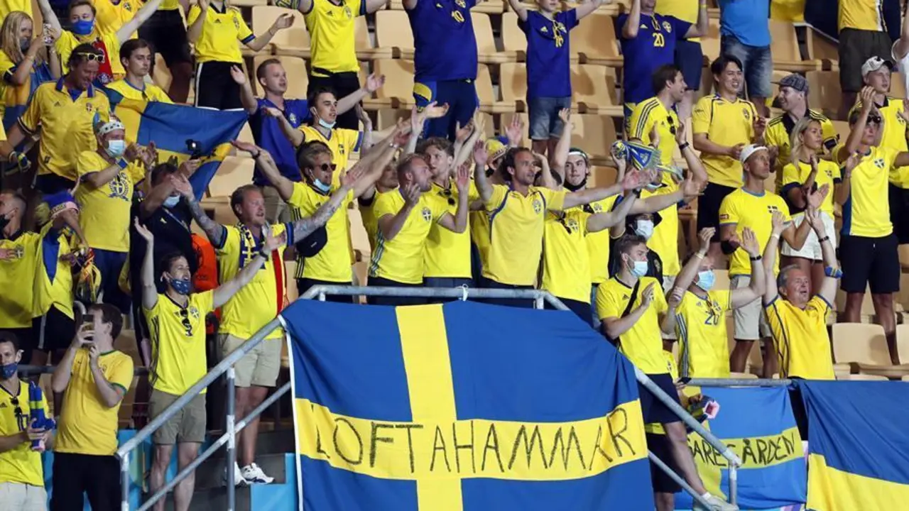 Supporters of Sweden cheer after the UEFA EURO 2020 group E preliminary round soccer match between Spain and Sweden in Seville, Spain, 14 June 2021. (Espa&ntilde;a, Suecia, Sevilla) EFE/EPA/Jose Manuel Vidal / POOL (RESTRICTIONS: For editorial news reporting purposes only. Images must appear as still images and must not emulate match action video footage. Photographs published in online publications shall have an interval of at least 20 seconds between the posting.)