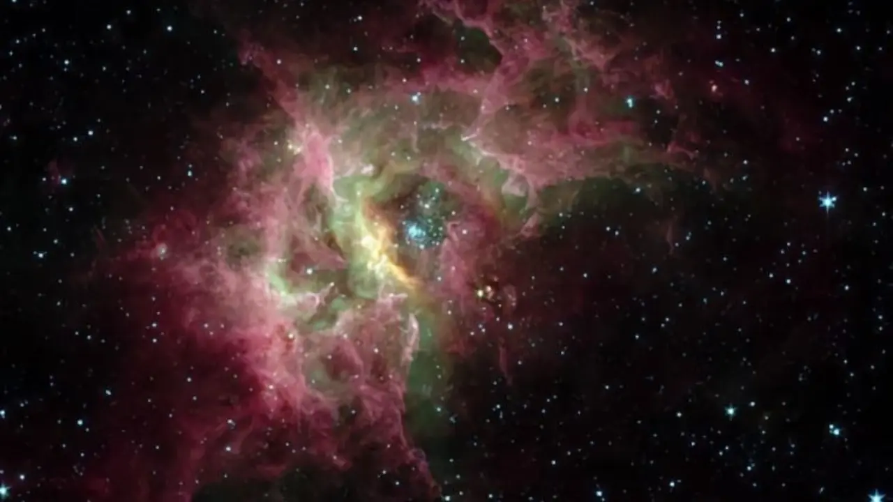 En el centro de la nebulosa de gas RCW 49 que se muestra aqu&iacute; hay un c&uacute;mulo de estrellas (Westerlund 2) rodeado por una burbuja en expansi&oacute;n de gas caliente.