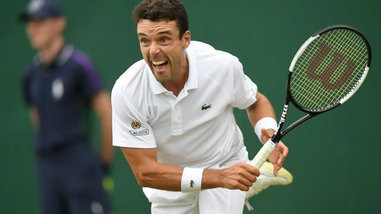 Roberto Bautista Agut of Spain in action against Miomir Kecmanovic of Serbia during their second round match at the Wimbledon Championships, Wimbledon, Britain, 30 June 2021. (Tenis, Espa&ntilde;a, Reino Unido) EFE