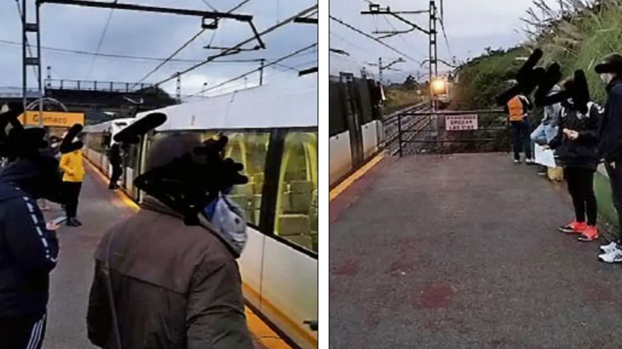 Varias personas en el anden viendo como el tren tiene que parar.